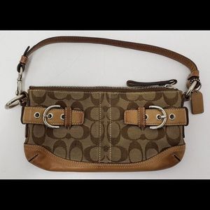 Woman’s Brown Coach purse bag